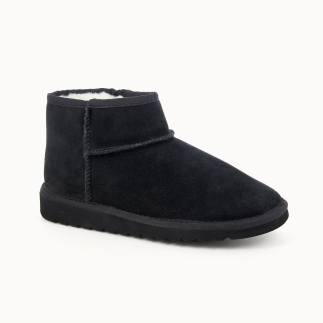 OKI women’s bootie slipper in black leather, wool lined — 3/4 view | Soir & Matin